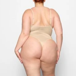 BARELY THERE SCOOP BODYSUIT | SAND -Underwear Specialty Shop SKIMS BODYSUIT BD THG 3141 DC SND 0013 BK