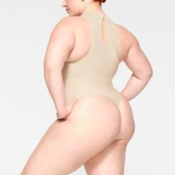 SEAMLESS SCULPT HIGH NECK THONG BODYSUIT | SAND 9 SEAMLESS SCULPT HIGH NECK THONG BODYSUIT | SAND -Underwear Specialty Shop SKIMS SHAPEWEAR BD THG 2905 JB SND 0007 SD