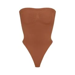 SEAMLESS SCULPT STRAPLESS THONG BODYSUIT | BRONZE