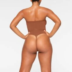 SEAMLESS SCULPT STRAPLESS THONG BODYSUIT | BRONZE -Underwear Specialty Shop SKIMS SHAPEWEAR BD THG 2913 IA BRZ 0017 BK