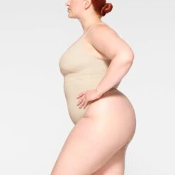 EVERYDAY SCULPT HIGH-WAISTED THONG | SAND -Underwear Specialty Shop SKIMS SHAPEWEAR PN THG 3150 JB SND 0010 SD 2816cba2 44d1 4991 9614 a074faa19a53