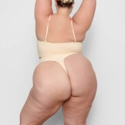 SEAMLESS SCULPT MID WAIST THONG | SAND -Underwear Specialty Shop SKIMS SHAPEWEAR SH MWT 0198 BB SND BK a7db05de 8988 4545 9c56 1fbe0177c0e1